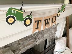 there is a sign that says two on it and a tractor in front of the fire place