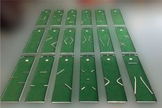 several pieces of green plastic with white lines on them