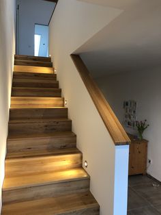 the stairs are made of wood and have lights on them