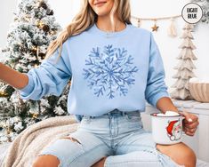 This blue toile inspired snowflake sweatshirt is the perfectly cozy crewneck to throw on during all of your holiday festivities or while relaxing at home.  Treat yourself, or make this a gift for the person in your life who loves the winter the most. PLEASE READ THROUGH ALL OF THE FOLLOWING INFORMATION.  IF YOU HAVE FURTHER QUESTIONS, WE ARE HAPPY TO HELP! Welcome to CuratedClothCo.!  Here you can find the perfect, trendy attire whether you are gifting for someone else or yourself.  We strive to provide quality merchandise and quick customer service in order to make your buying process fun and easy.  We hope you love our designs as much as we do! FREE SHIPPING ON ALL ORDERS SHIPPED WITHIN THE U.S.!! *Orders typically arrive 7-14 days after purchase, although they many arrive sooner. *Produ Snowflake Sweatshirt, Watercolor Snowflake, Snowflake Sweater, Screen Printing Techniques, Blue Toile, Buying Process, Orders Shipped, Winter Gift, Sweatshirt Christmas