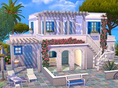 a large white house with blue shutters and pink flowers on the front, stairs to the second floor