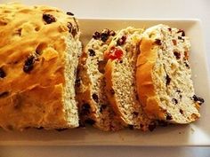 a loaf of bread with raisins is on a plate