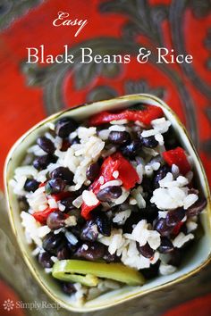 black beans and rice in a bowl on a red tablecloth with the words easy black beans and rice