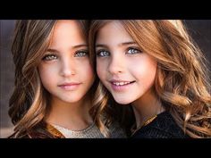 two beautiful young women standing next to each other in front of the camera with their eyes open