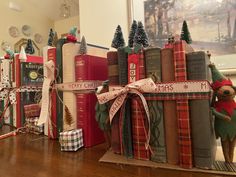 christmas books are stacked on top of each other