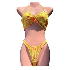 Vintage yellow Hawaiian print thong bikini with cute twisty bandeau style top. Adorable tropical print with hibiscus's flowers and pineapples. Made in USA. No size but bottoms are super tiny best for an xs/s and top is versatile and could fit someone busty or not since it's wide but has no padding to fill out! Thin without lining.  -By purchasing you agree to my shop policies Hawaiian Print, Hibiscus Flowers, Vintage Yellow, Tropical Print, Shop Policies, Hibiscus, Halloween Shopping, Top Styles, Made In Usa