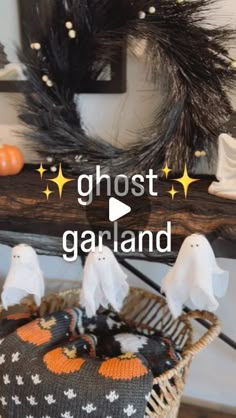 a basket with ghost decorations on it and the words ghost garland in front of it