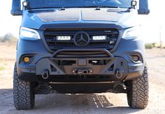 the front end of a mercedes benz truck