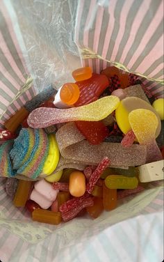 a bag full of gummy bears sitting on top of a table