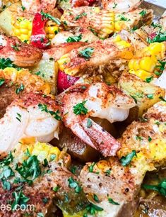 shrimp and corn on the cob in a skillet