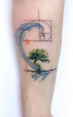 a man's arm with a tree on it and a basketball hoop in the middle