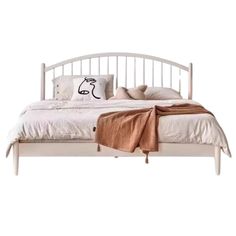 a white bed with pillows and blankets on it's headboard, against a white background