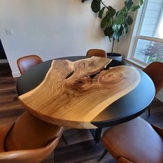 a wooden table with chairs around it