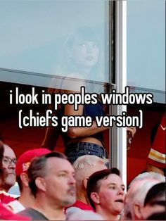 a woman standing in front of a window with the caption i look in peoples windows chiefs game version