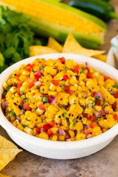 corn salsa in a white bowl with the title above it