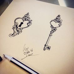 a drawing of two keys on top of a piece of paper next to a pen