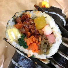 sushi with various vegetables and sauce on it