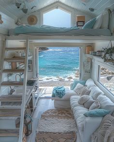 there is a loft bed in the living room with stairs leading up to the beach