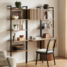 a room with a chair, bookshelf and other items on the shelves in it