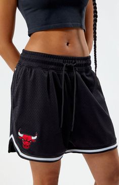 Dominate the court in style with the Chicago Bulls Basketball Shorts from Pro Standard. Emblazoned with the iconic Bulls logo embroidery at the hem, these shorts combine performance and team spirit, ensuring you stay cool and rep your team with pride whether you're on or off the basketball court.12" rise5" inseamMesh basketball shortsDrawstring waistbandBulls logo embroideryCurved hemContrast stripe hemRelaxed fitSide hand pockets100% polyesterMachine washableModel is wearing a size smallModel measurements: 5’5” height, 32” bust, 22” waist, 32” hips ProStandard Womens Chicago Bulls Basketball Shorts - Black size XS Chicago Bulls Ropa, Basketball Shorts Outfit, Gyaru Hair, Basketball Shorts Girls, Bulls Logo, Chicago Bulls Basketball, Bulls Basketball, Shorts Outfits Women, Basketball Clothes