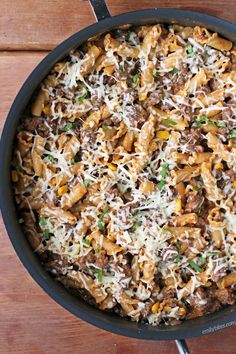 a skillet filled with pasta and ground beef