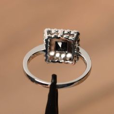 It is a natural black spinel ring, princess cut, measures 5mm*5mm, weight about 0.54 cts. The basic metal is sterling silver and plated with rhodium. To change the metal to a solid gold (white/rose) or platinum is also available, please ask for a quotation if you want. You can also go to my shop Home for more elegant rings: https://www.etsy.com/shop/godjewelry?ref=hdr_shop_menu More black spinel rings: https://www.etsy.com/shop/godjewelry?ref=seller-platform-mcnav&section_id=21680005 Customi Black Spinel Ring, Spinel Ring, Princess Cut Rings, Black Spinel, Elegant Ring, Princess Cut, Promise Rings, Silver Fashion, Heart Ring