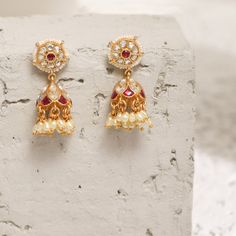 Description This timeless jhumki earring is perfectly crafted with polki stones on a gold-plated setting and finished with precious stones. An elegant wardrobe essential, these jhumki earrings will be your favorite. Style with the complementary accessories from the Vihara family for a grand look. This is the perfect choice for festival events and weddings. Product Information Materials used: 925 Silver with 1.0-microns Antique Gold Plating Stones: Semi precious stones Length: 3.5 cm Findings: Ho Luxury Fusion Style Jhumkas With Stone Work, Gold Plated Latkans Temple Earrings, Gold Plated Latkans Temple Jewelry Earrings, Gold Plated Temple Jewelry Earrings With Latkans, Gold Plated Tilla Jhumkas In Temple Jewelry Style, Gold Plated Tilla Jhumkas Temple Jewelry, Gold Plated Chandbali Traditional Jhumkas, Gold Plated Meenakari Jhumkas Temple Jewelry, Navratri Latkans Jhumka Drop Earrings