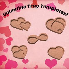 valentine's day treats are arranged in the shape of hearts on a pink background