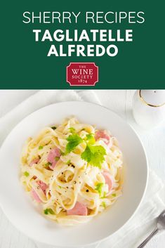 a white plate topped with pasta covered in ham and parsley next to a cup of coffee