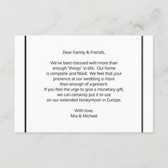 a white card with the words dear family and friends on it in black lettering, against a marble background