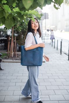 This handmade women tote bag is produced of cowhide leather. It has one pocket inside. The bag has a high-quality zipper that secures your belongings. It holds the shape perfectly and you may be confident that your personal things like cell phone, tablet, lap-top are safe. This bag is simple, reliable, and durable. Its universal look allows to use the tote bag for various purposes. One may take the bag to the work, shopping, meeting, or walk and feel comfortable with it at any conditions. SIZE and DIMENSIONS:  〰️ SMALL 〰️ Height: 12 inches (30 cm) Width (the top): 12.6 inches (32 cm) Width (the bottom): 9 inches (23 cm) Depth: 4.3 inches (11 cm) 〰️ MEDIUM 〰️ Height: 13.4 inches (34 cm) Width (the top): 14.6 inches (37 cm) Width (the bottom): 11 inches (28 cm) Depth: 4.3 inches (11 cm) 〰️ L Blue Bag For Daily Use With Smooth Grain, Blue Smooth Grain Bag For Daily Use, Blue Smooth Grain Bag For Everyday Use, Blue Smooth Grain Bag, Blue Smooth Grain Shoulder Bag For Everyday Use, Personal Things, Lap Top, Genuine Leather Totes, Custom Tote Bags