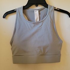 Fabletics Women's Trinity High Impact Sports Bra Small/ 5/6 Grey With Neon Orange Accent On Back High Neck Wide Bottom Elastic Band Triple Pocket Design Body 81% Nylon 19% Elastine Mesh 73% Nylon 27% Elastine Brand New With Tags Lululemon Nwt Power Pivot Tanks, High Impact Sports Bra, Orange Accents, Orange Grey, Neon Orange, Pocket Design, Elastic Band, Women's Intimates, High Neck