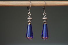 "Dark Blue Earrings Dangle drop Earrings Czech Glass Earrings Gift for her Gift for women Christmas Gift Color : Dark Blue Sapphire Blue 20x9mm Faceted Teardrop Beads, Dark Bronze Finish, Translucent, Czech Republic Glass Beads Finish : Antiqued copper findings Length : Approx 1 3/4 inches including the antique copper lever back Ear wires : Antique copper lever back These earrings are light, comfortable and easy to wear everyday. Leverbacks keep your earrings on securely by creating a closed loo Blue Teardrop Copper Earrings, Blue Copper Teardrop Earrings, Dark Blue Earrings, Navy Blue Earrings, Teardrop Beads, Women Christmas, Square Earrings, Blue Jewelry, Earrings Blue