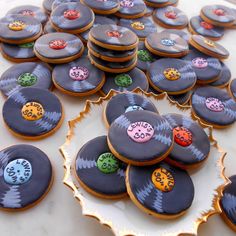 decorated cookies are arranged on a platter