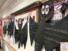 a classroom wall decorated with halloween decorations