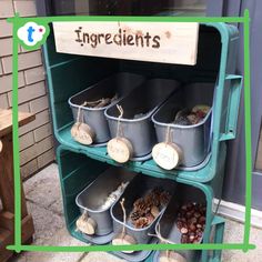 an old metal shelf filled with buckets next to a sign that says ingredients on it