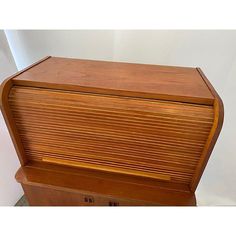 an old wooden chest is shown with the lid open