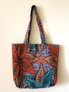 an orange and blue bag hanging on a wall