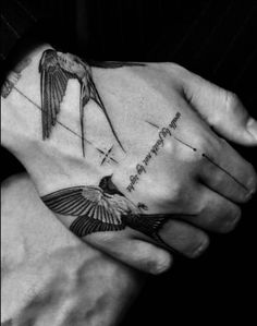 a person holding their hand with a bird on it and the words love is in the air