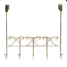 a coat rack with three hooks and two coats hanging from it's sides, against a white background