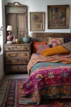 a bed sitting in a bedroom next to a window with pictures on the wall above it