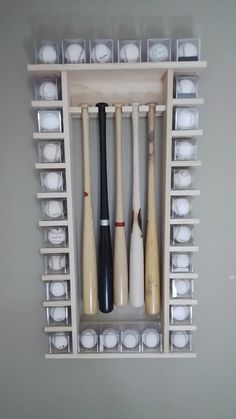 a wooden shelf filled with baseball bats and plates