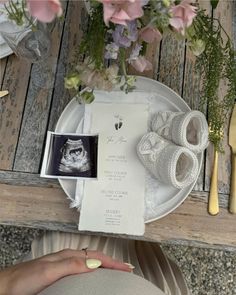 a table with flowers and napkins on it, including a cat's head