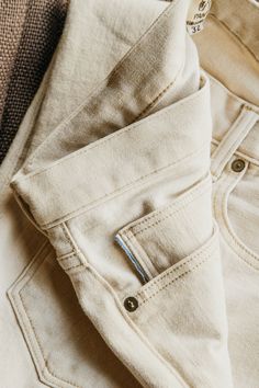 Our premium denim is inspired by the classic vintage blue jean. Our Premium Japanese 4-Way Stretch Selvedge denim story starts in Japan where our fabric is developed at one of the oldest denim mills. We blend a unique 4 way stretch material with selvedge denim to create a specific amount of stretch and comfort you wouldn’t typically get with selvedge denim. This 360 degree of stretch gives the wearer comfort from every angle no matter what they are doing. We make this ivory colored denim by taki Standard Cut Leg Washed Cotton Jeans, Selvedge Cotton Jeans With Straight Hem, Selvedge Straight Hem Cotton Jeans, Classic Denim Blue Cotton Jeans, Everyday Washed Cotton Jeans, Denim Blue Cotton Jeans With Welt Pockets, Classic Washed Cotton Jeans, Beige Cotton Jeans With Five Pockets, Everyday Beige Denim Jeans