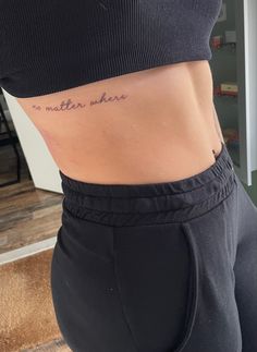 a woman's stomach with the words no matter where written on her lower back