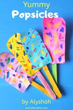 four popsicles made out of paper with the words yummy popsicles written on them