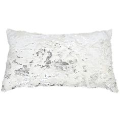 a white pillow with silver sequins on the front and back, against a white background