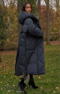 Stay stylish and cozy this winter with our Women's Down Cotton Parkas, a long overcoat designed for comfort and warmth. This thick, hooded coat is perfect for braving the cold while maintaining a fashionable look, making it an essential piece for your winter wardrobe. Crafted from a durable blend of cotton and polyester, this parka features high-quality cotton filling that provides excellent insulation against the chill. The coat is adorned with functional pockets, trendy patch designs, and a se Thick Hooded Parka For Fall, Thick Hooded Winter Outerwear, Winter Long Coat Puffer Jacket With Detachable Hood, Oversized Black Winter Parka, Black Thick Outerwear For Fall, Thick Black Outerwear For Fall, Hooded Thick Puffer Jacket For Cold Weather, Winter Hooded Puffer Parka, Thick Winter Parka For Cold Weather