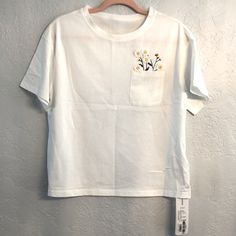 Nwt Cute Embroidered Daisy’s T-Shirt From Japan Says Size Small. Boxy Fit 18.5 Inch Across The Front Bust 23 Inch’s From Shoulder To Hem 6.5 Inches Across Shoulder 6.5 Inch Sleeve White Cotton Cropped T-shirt For Spring, White Floral Embroidery Relaxed Fit Top, White Floral Embroidered Relaxed Fit Top, White Floral Embroidered Relaxed Top, White Crew Neck Top With Floral Embroidery, Casual White Top With Floral Embroidery, White Floral Embroidered T-shirt For Spring, Casual Cotton Tops With Floral Embroidery, White Short Sleeve T-shirt With Floral Embroidery