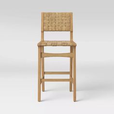 a wooden chair with a woven seat and backrest, viewed from the front view